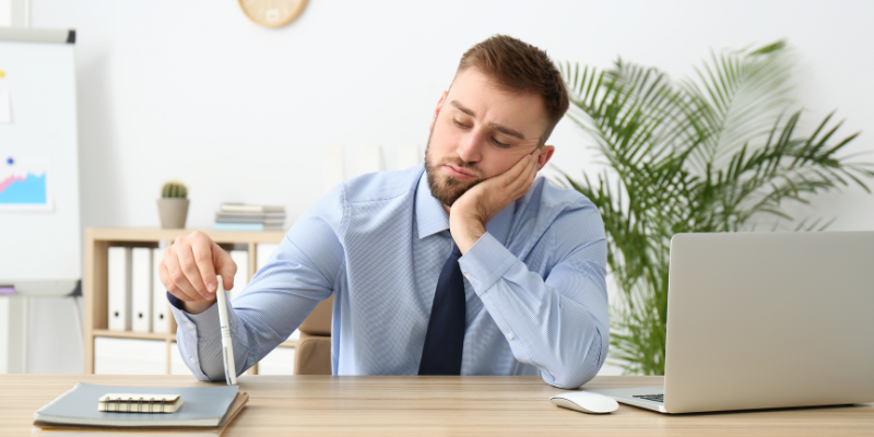 a man experiencing burnout from work