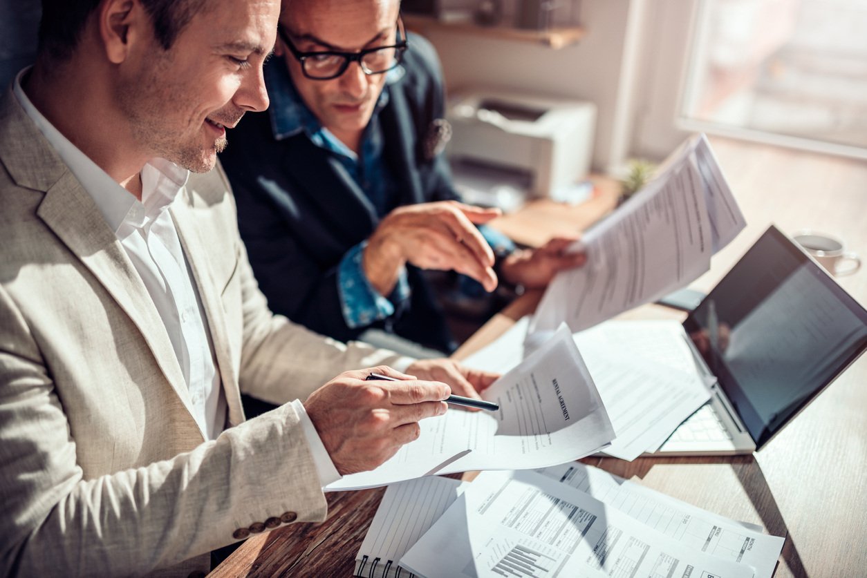 Photo of people with paperwork