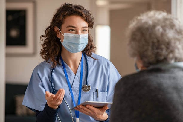 Image of a medical professional talking to a patient