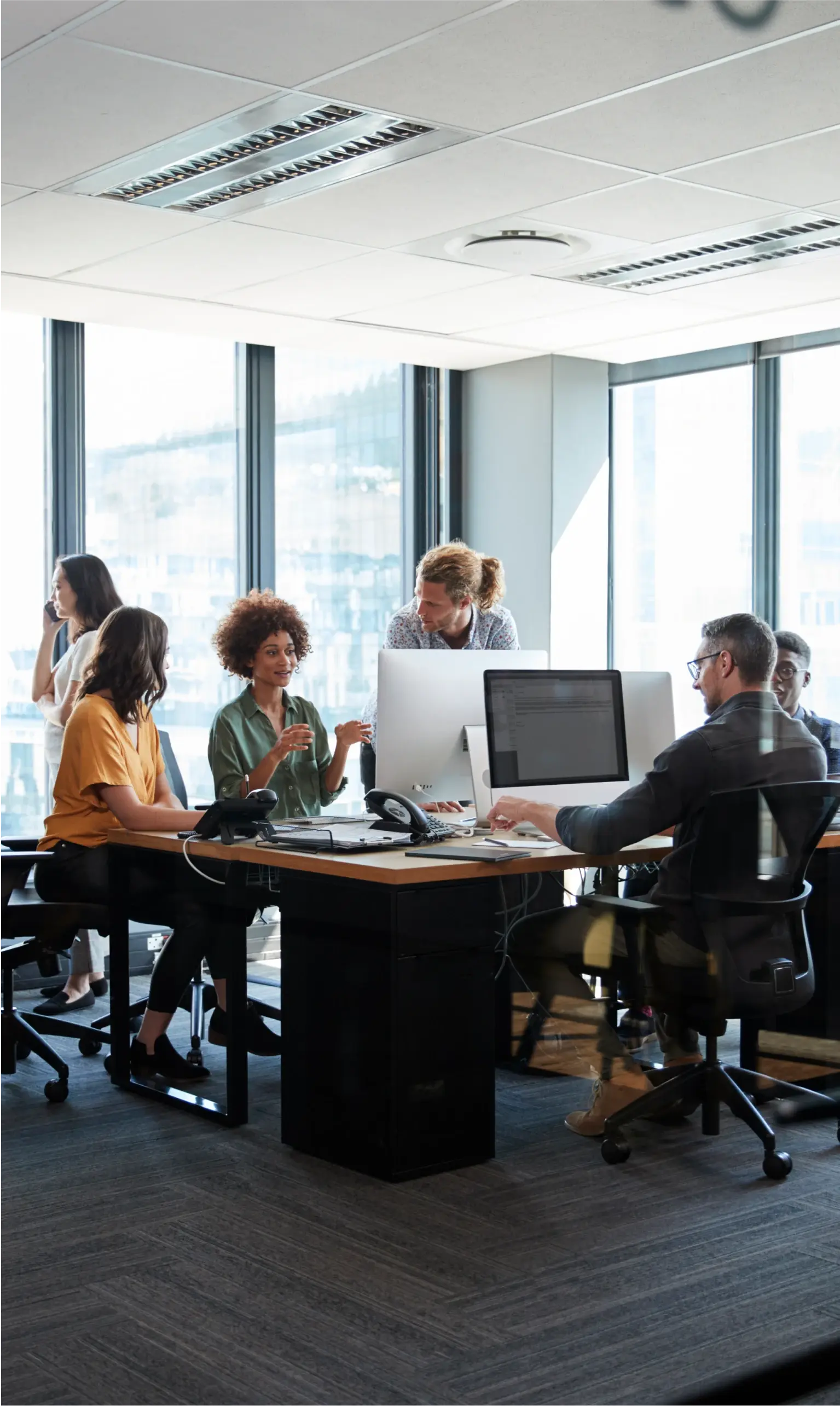 Team working in a big office at a conference table