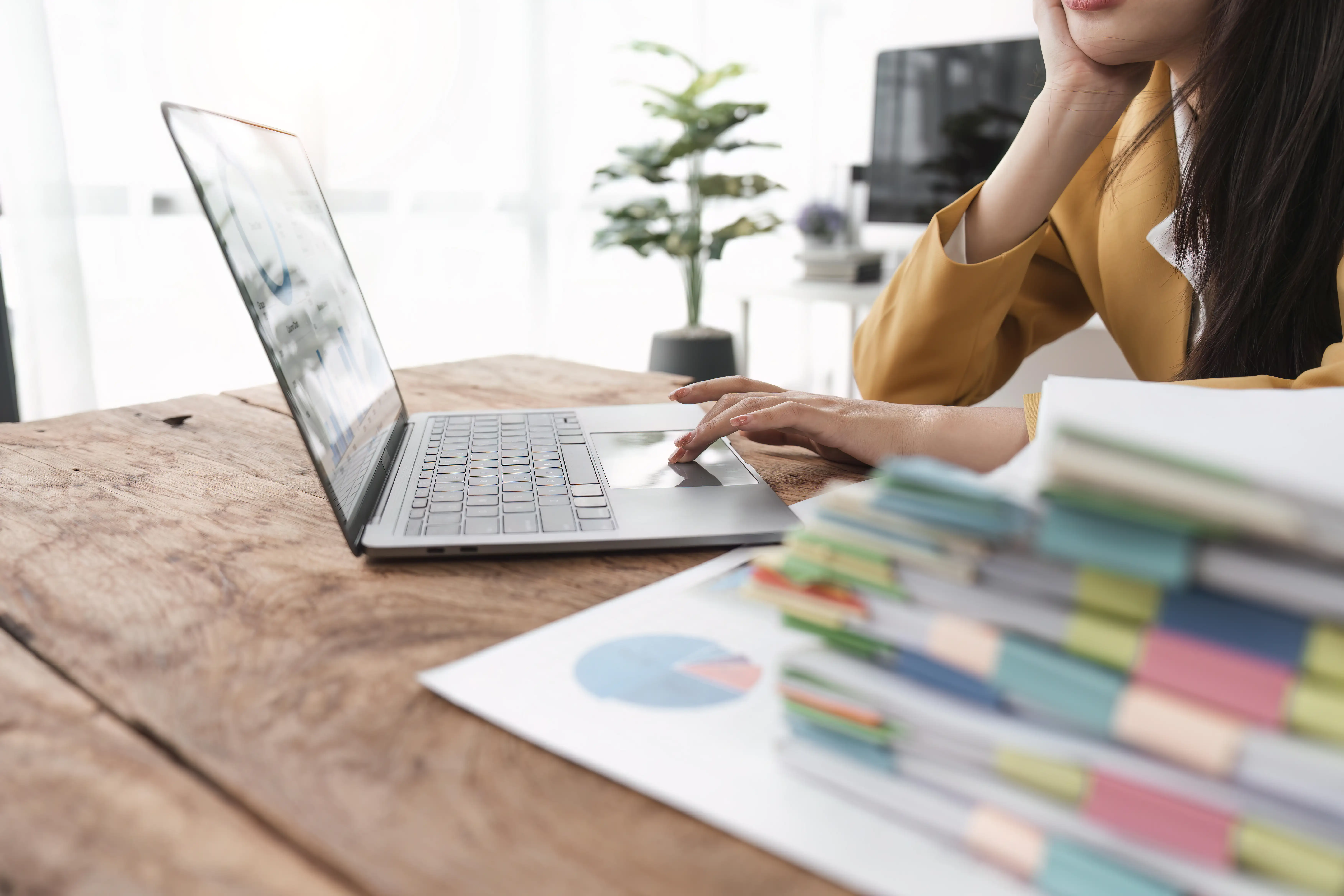 businesswoman-or-accountant-using-a-laptop