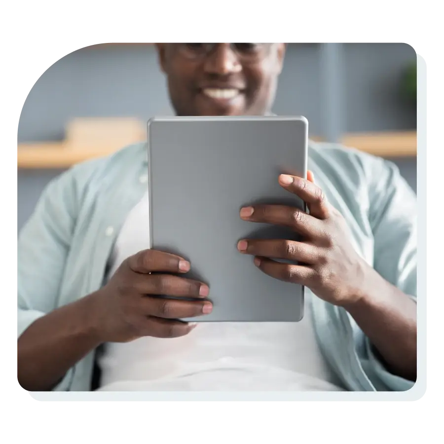 man_looking_at_ipda_with_ebook_on_screen