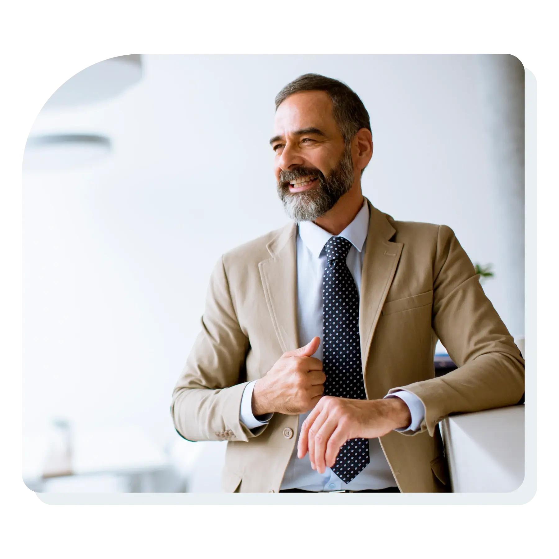 professional_man_smiling_standing_up_in_suit