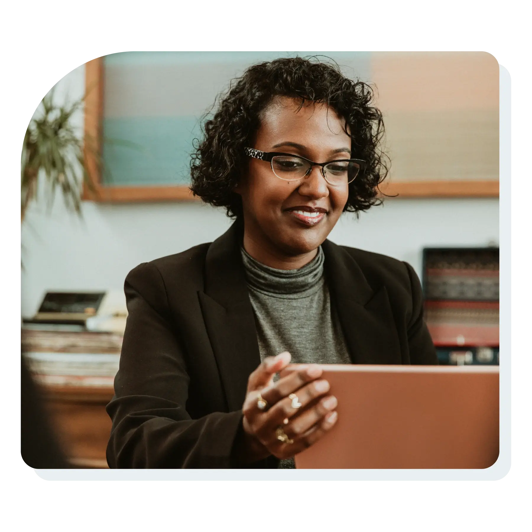 professional_woman_on_a_laptop_in_conference_room