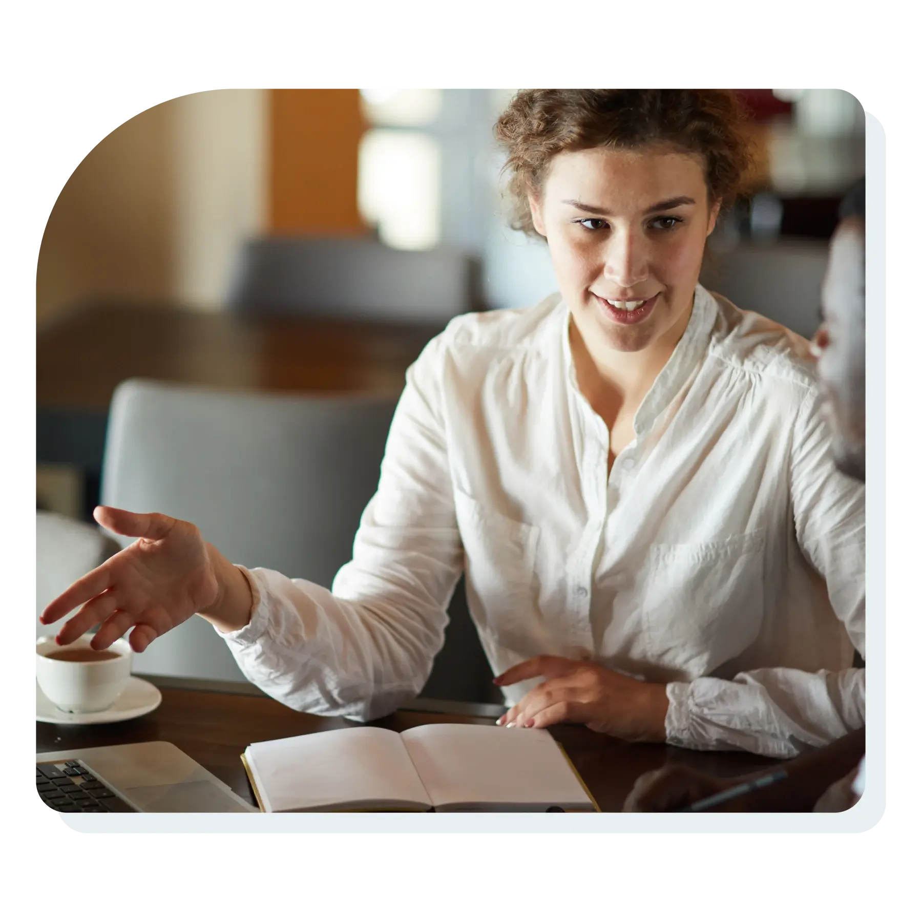 professional_woman_talking_with_a_client_at_a_table