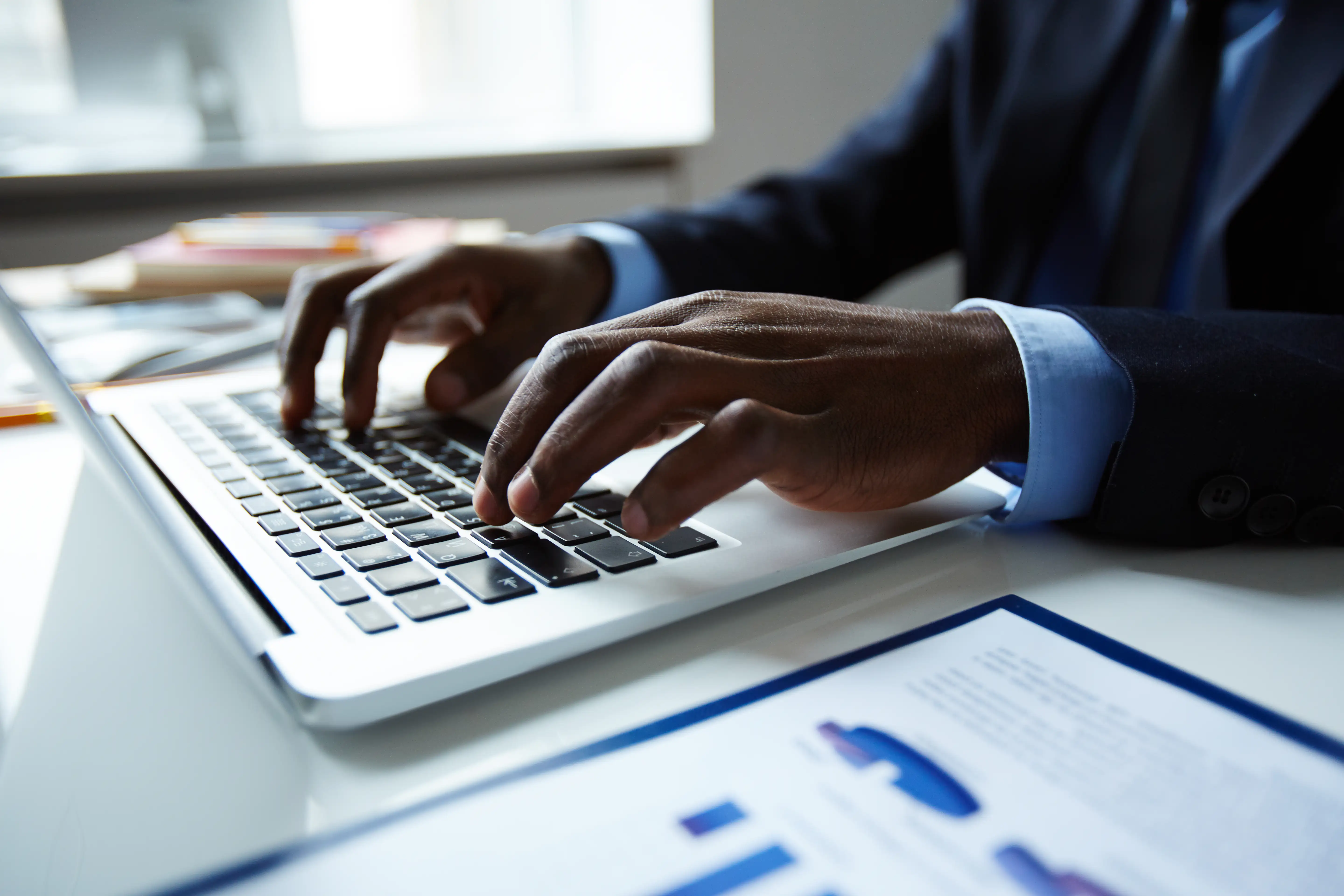 Man typing on computer