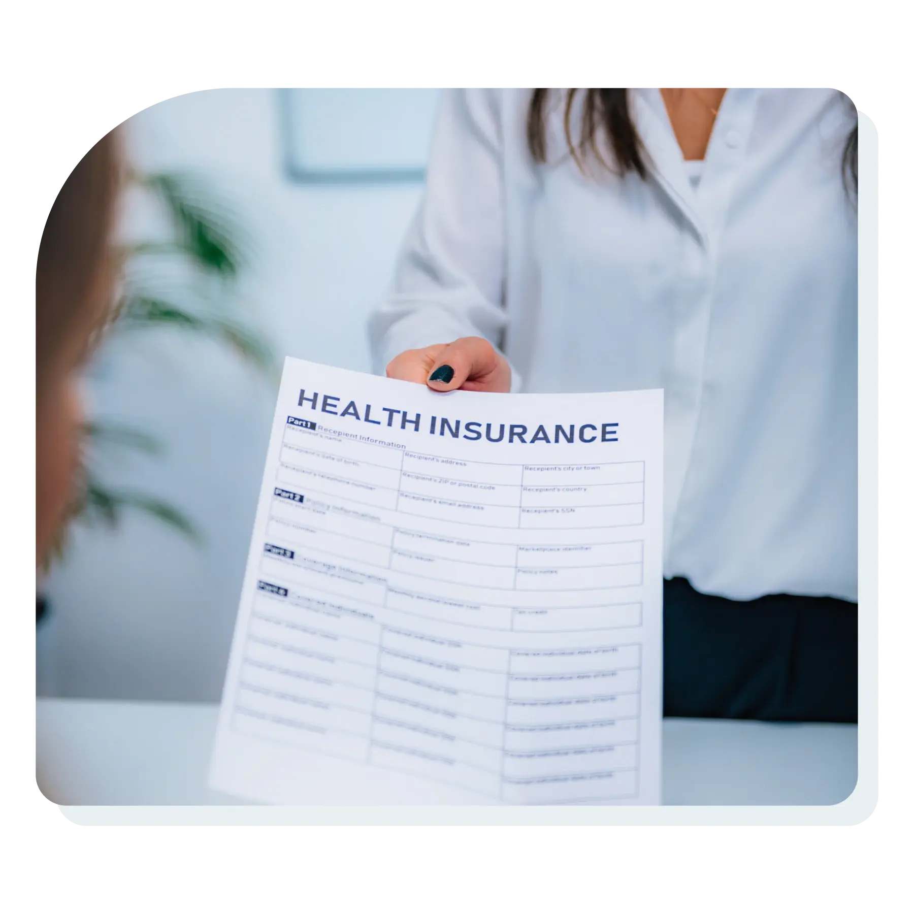 woman_handing_health_insurance_document_to_dr