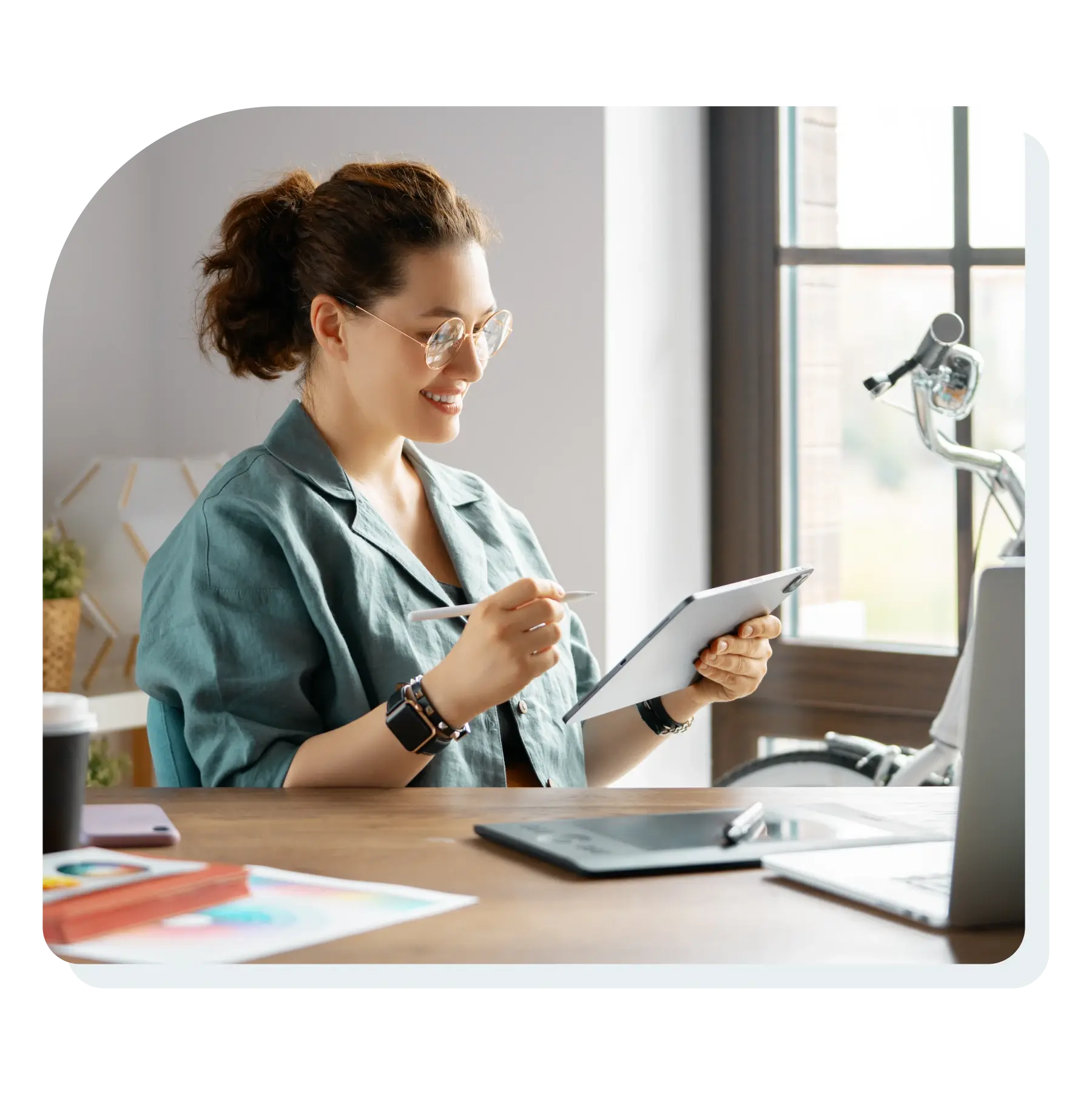 woman_sitting_at_desk_looking_at_digital_documents