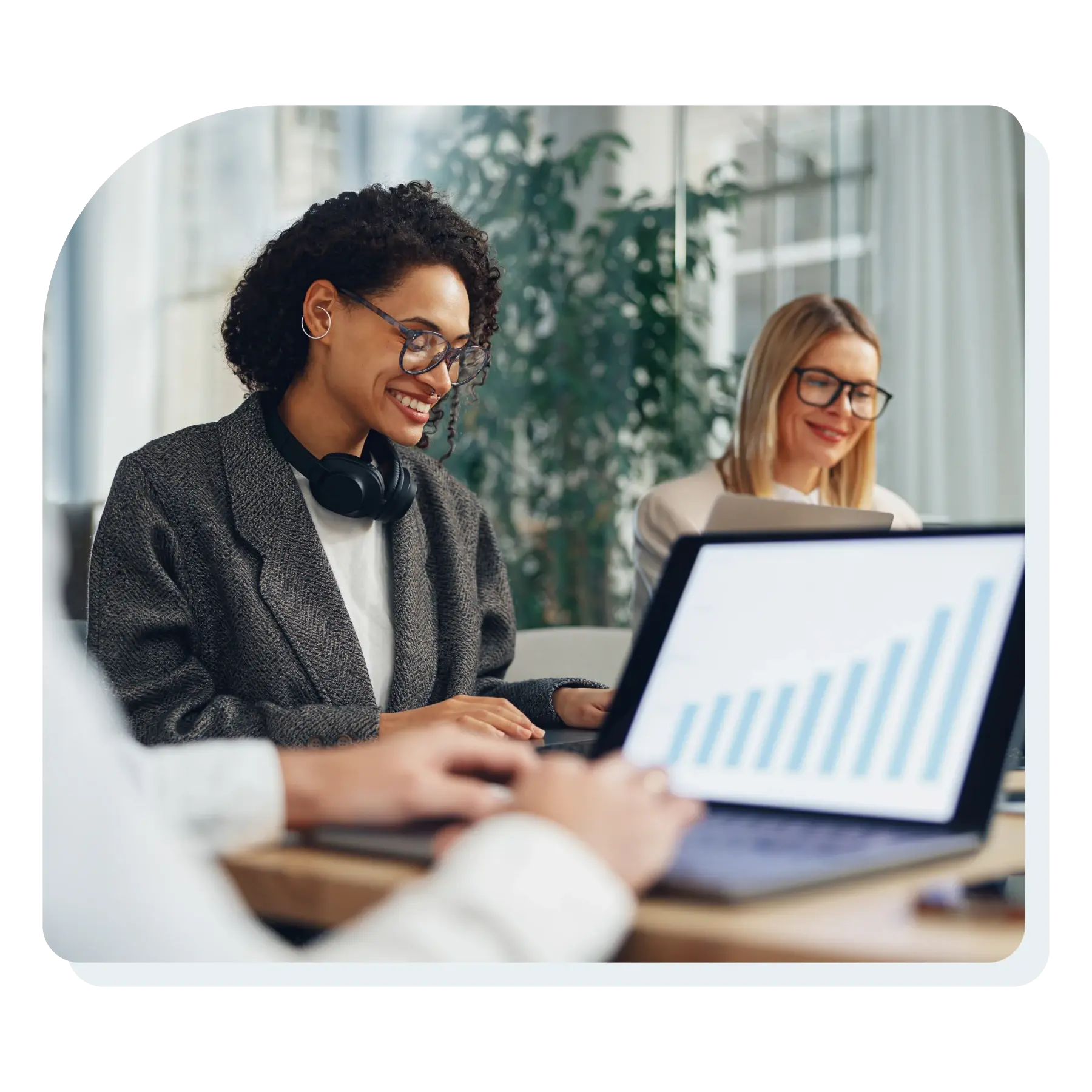 woman_smiling_looking_at_data_on_a_computer