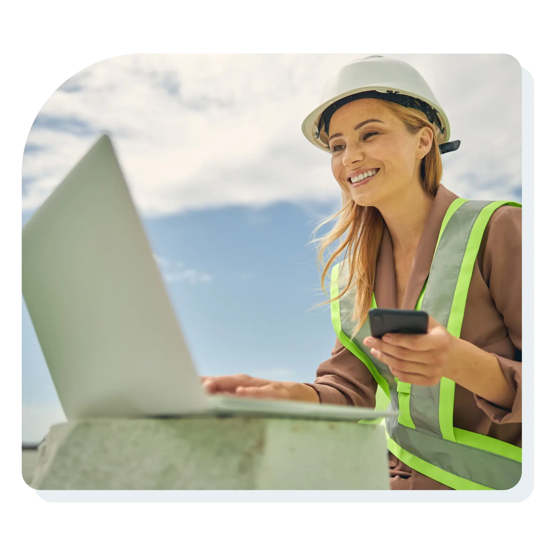 young_woman_field_service_worker_smiling_looking_at_her_computer